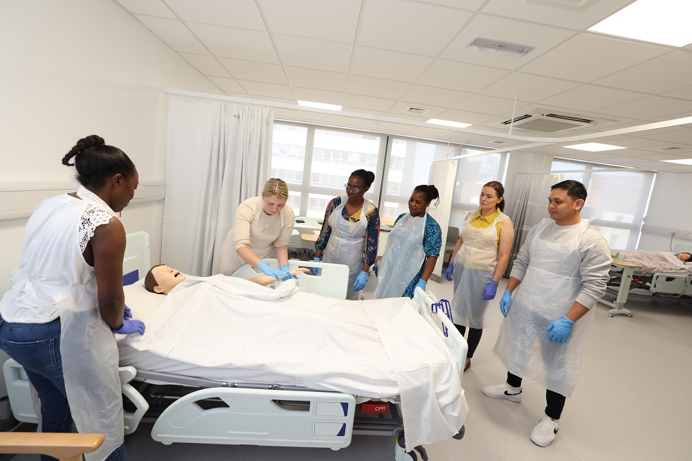 Eldon Court Education Centre - students round a replica patient bed