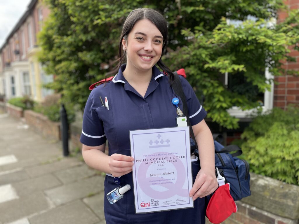 District Nurse Practitioner Georgia Hibbert with her Philip Goodeve Docker Memorial Prize certificate